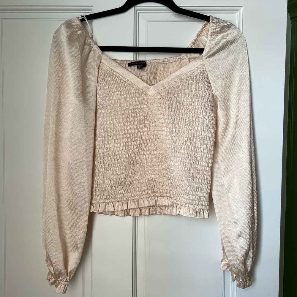 Light pink, shimmery long sleeve fitted top